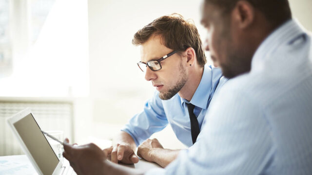 CILT Membership Levels - Two men looking at a laptop together